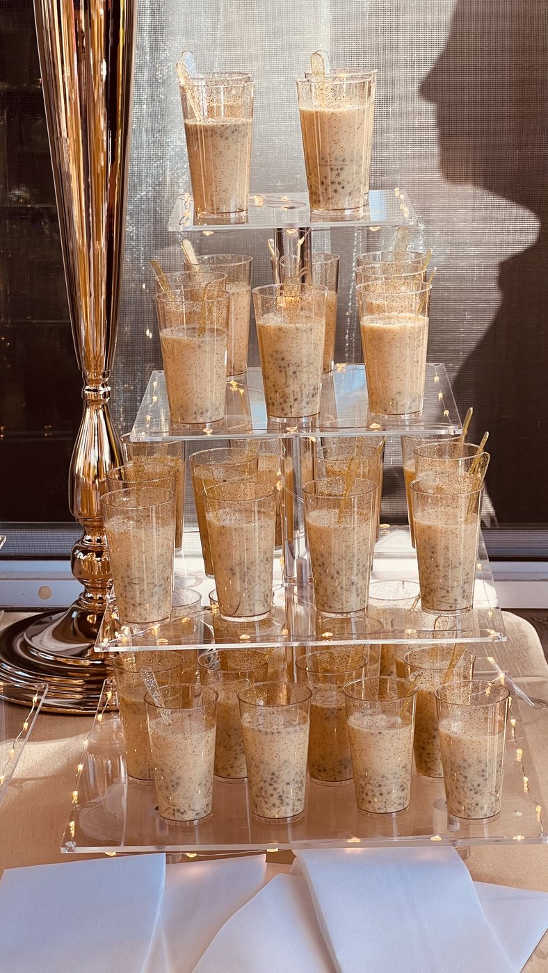 Elegant tiered falooda dessert display with fairy lights at a Honest event